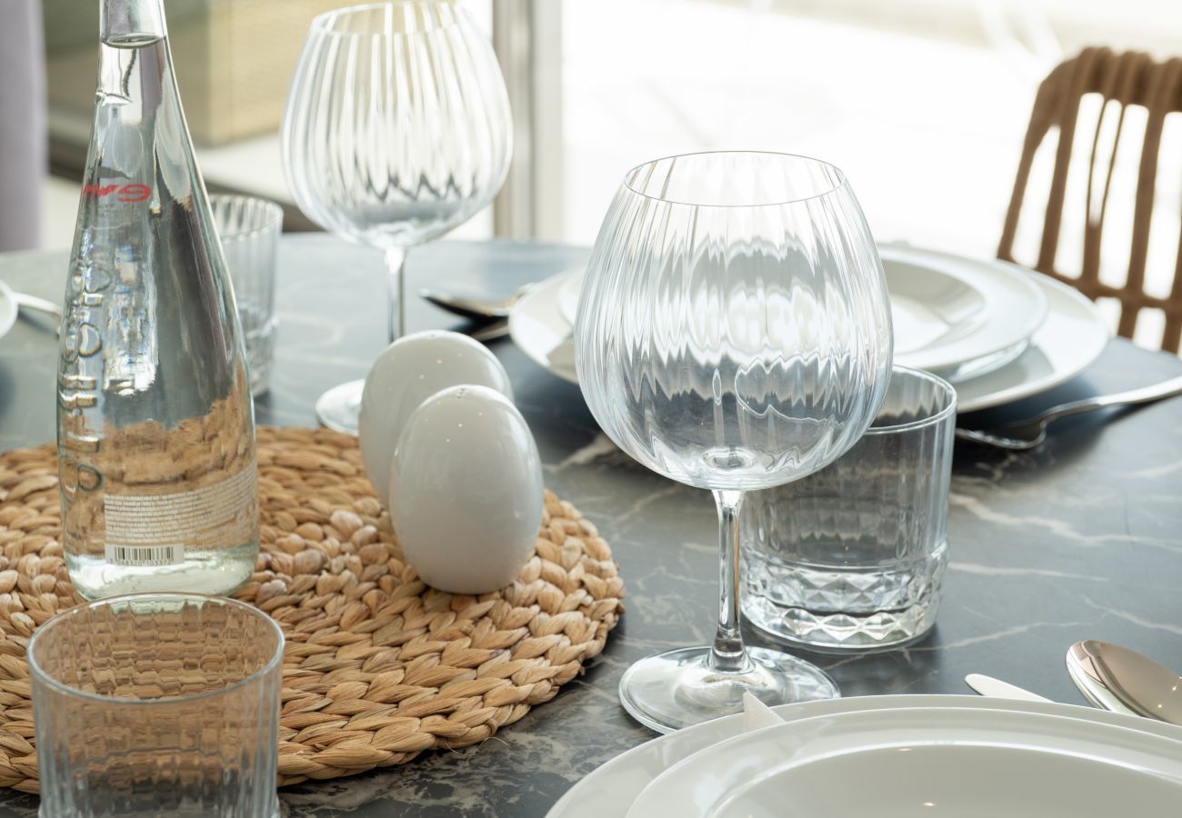 Dining table with plates and glasses